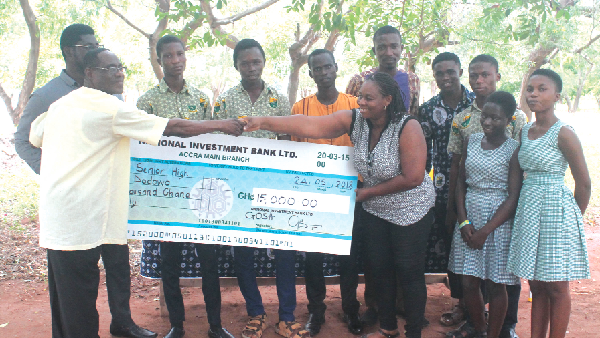Ms Antoinette Adraki (right) receiving the cheque on behalf of the school from Mr Roosevelt Odai Otoo (left). Picture: Maxwell Ocloo