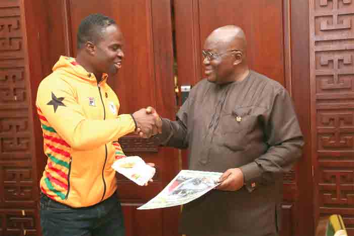 Akwasi Frimpong being congratulated by President Akufo-Addo when the Olympian visited the Jubilee House