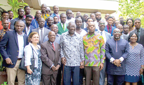 Former President Kufuor (middle) with officials of  the Ghana Job Bank and guests during his induction as the Life Patron of the Job Bank 