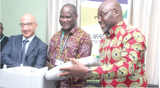 Mr Sergio Piccolo, Attaché of Affairs, European Union,   symbolically  handling over  a drone to Mr John Pwamang (2nd left), Acting Executive Director, EPA. With them is  Mr Ebenezer Sampong (right), Deputy Executive Director, EPA. Picture: BENEDICT OBUOBI 