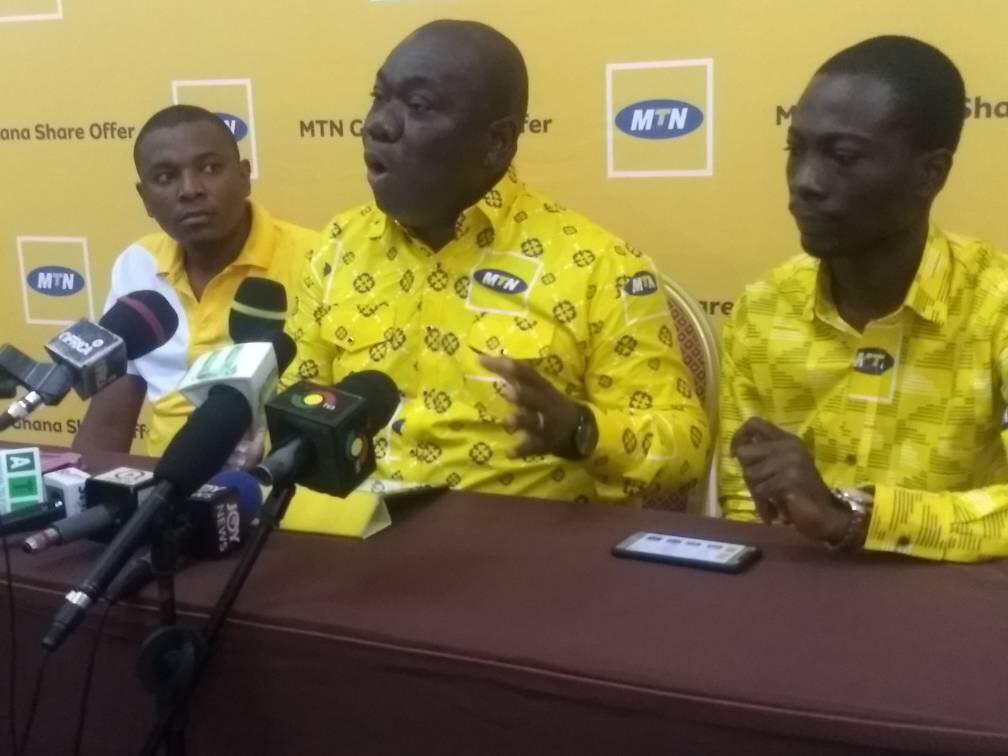 Mr Addo (middle)  delivering his address