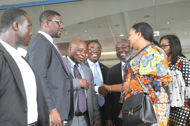 Mrs Rebecca Akufo-Addo in a handshake with Dr Yaw Yeboah, Council Chair, GHS.  Those with them are from  (left): Mr Niyi Ojuolape, UNFPAS, Mr Kwaku Agyemang Manu, Minister of Health, and Dr Nsiah Asare, Director General, Ghana Health Service. 