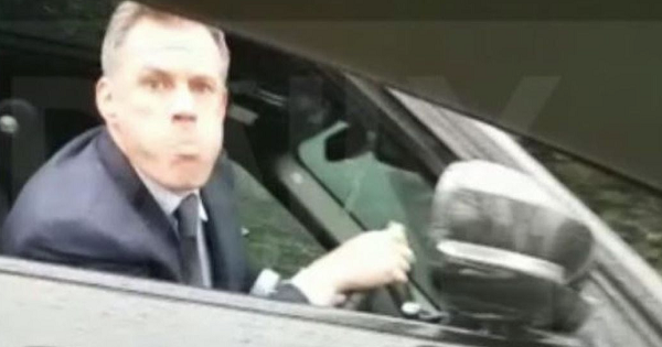 Ex-footballer Jamie Carragher moments before spitting