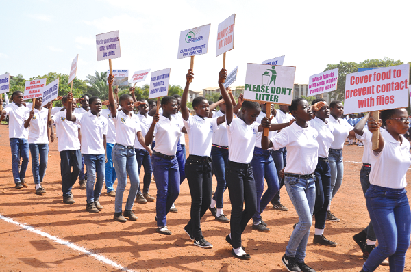 Members of the Zoomkids Club from Sowa Din Memorial JHS 1&2 and the Adenta Community School with placards educating spectators while they marched in Accra.