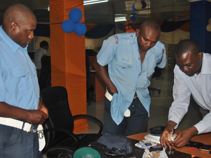 Library photo: EACC officers search traffic police officers arrested while taking bribes in Kilifi in June 2015. 
