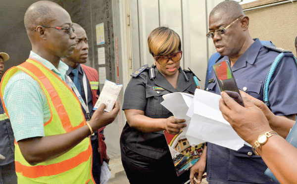Officials of Customs conducting an inventory on the products in the container at the Reefer Yard prior to their destruction
