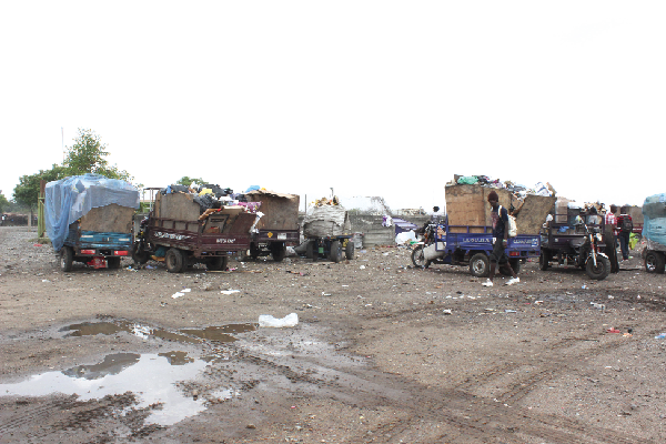 Some of the tricycles parked at a transit point along the mortuary road 