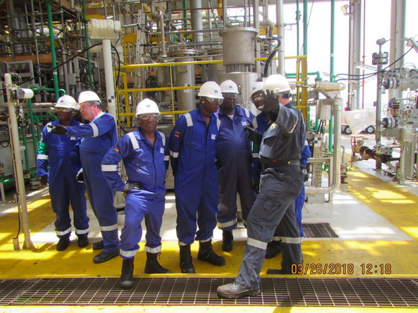 Mr Ben Harris (right), Offshore Installation Manager, Tullow, taking the delegation through the operations of the production platform