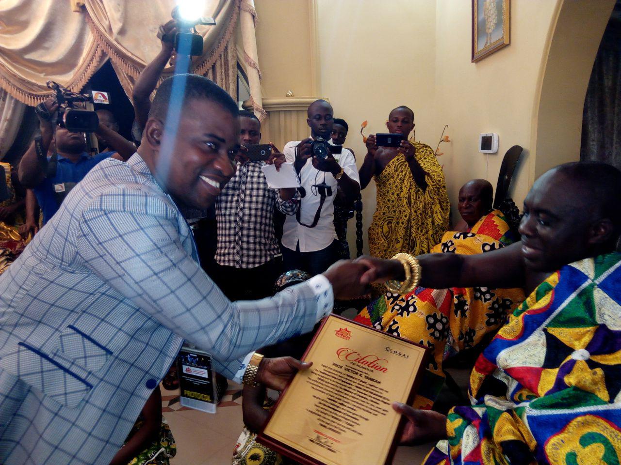 Presenting the citation to Nana Oboadum (R), the President of COGAI, Dr Edward Brenya, (L) said the honour was for the chief’s transformation of Domeabra from a village to a town.