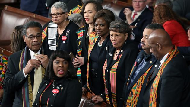 Members of Congress wear black clothing and Kente cloth in protest before the State of the Union address.