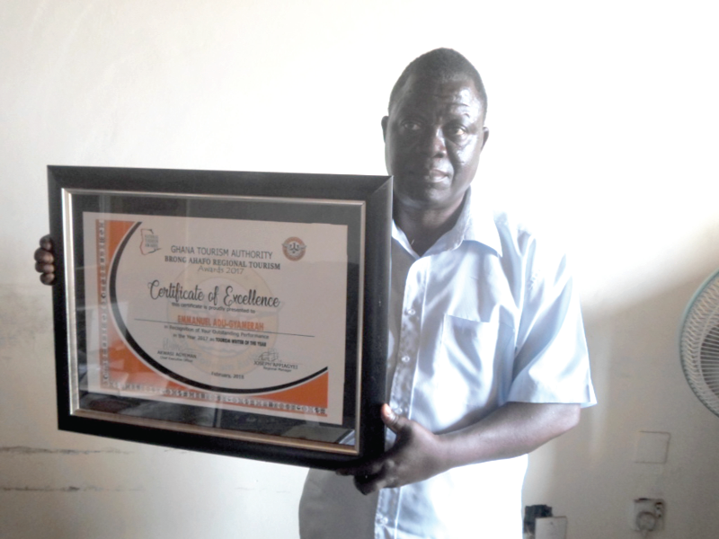 Mr Emmanuel Adu-Gyamerah displaying his award