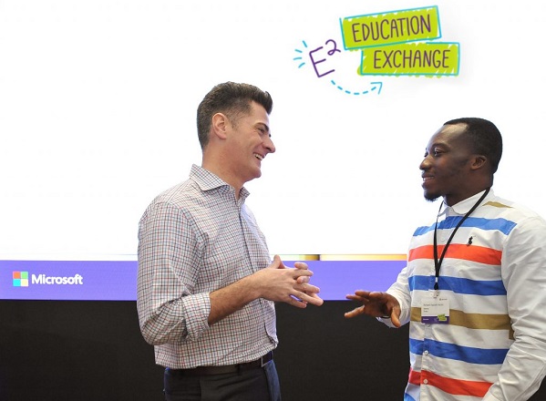 Anthony Salcito, Vice President, Worldwide Education at Microsoft (left) congratulates Richard Appiah Akoto, a teacher from Ghana at Education Exchange in Singapore