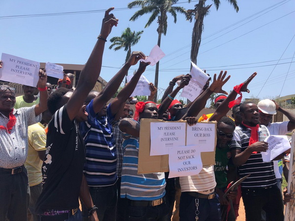 Some of the workers of the Indian businessman demonstrating