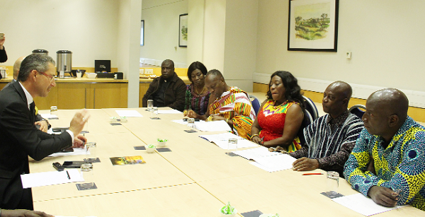 Just before the signing,  Mr Daniel Xuereb (left) makes a point. On the right is the Ghanaian delegation.