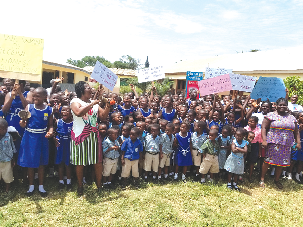 Students of the Osu Cluster of Schools making a pledge to support the Ring the Bell Campaign.