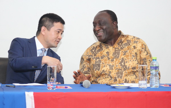 Mr Alan Kyeremanten, the Minister of Trade and Industry, interacting with Mr Chen Yougxin, President, China National Building Material Company Limited