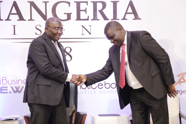 Dr Mahamudu Bawumia (left) in a handshake with Mr Olufemi Michael Abikoye, the Nigerian High Commissioner in Accra, after the launch.