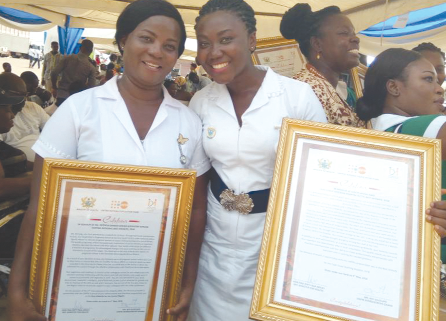 Ms Judith Ofosu Adjei of the Cape Coast Teaching Hospital (right) and Ms Patricia Djimate, the winner for the Central Region, displaying their awards