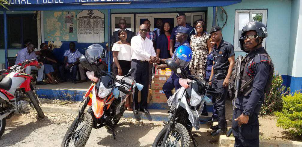 Mr Yirenkyi (left) handing over the items to Chief Superintendent Amaning