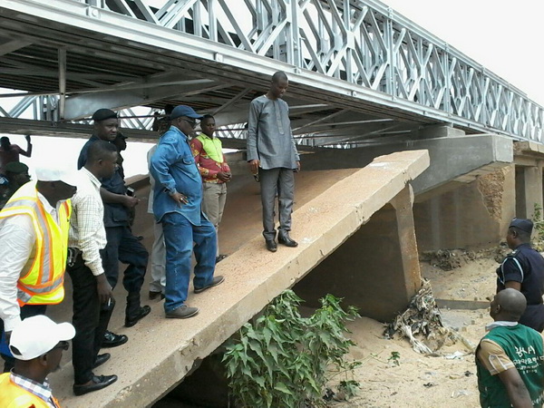 The Upper East Regional Minister, Mr Rockson Bukari (arrowed) and his entourage inspecting work on the Kulungugu bridge