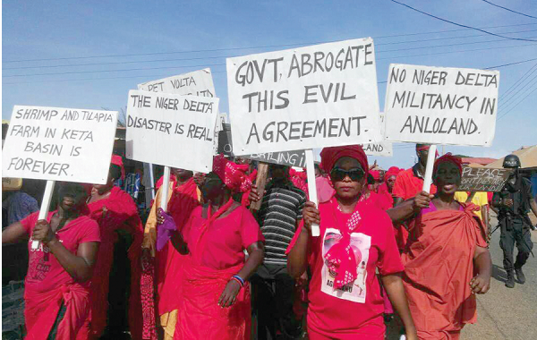 Some of the demonstrators displaying their placards