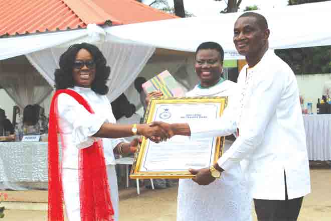 Ms Gloria Afua Akuffo (left), the Attorney General and Minister of Justice,  presenting an award to Superintendent Francis Baah, one of the retired officers. With them is DCOP Maame Tiwaa Addo-Danquah. Picture: Emelia Ennin Abbey