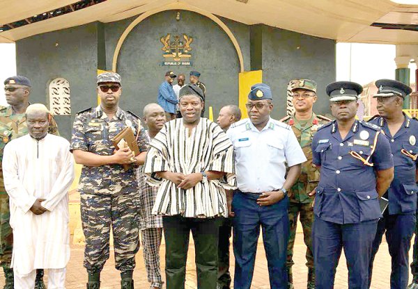 Mr Salifu Saeed (in smock) with Air Commodore Alfred Augustine Appiah (4th left), Mr Prosper Agblor (5th left), Mr Nathan Kofi Boakye (2nd left) and senior security officers after the meeting