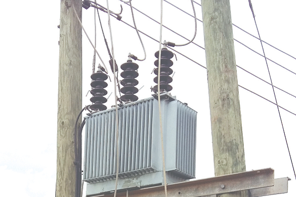 The cut cables hanging on the transformer