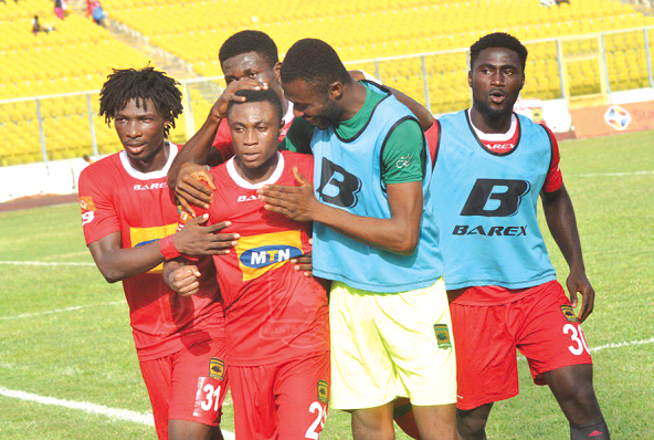 Emmanuel Gyamfi of Kotoko joined by teammates to celebrate his opener
