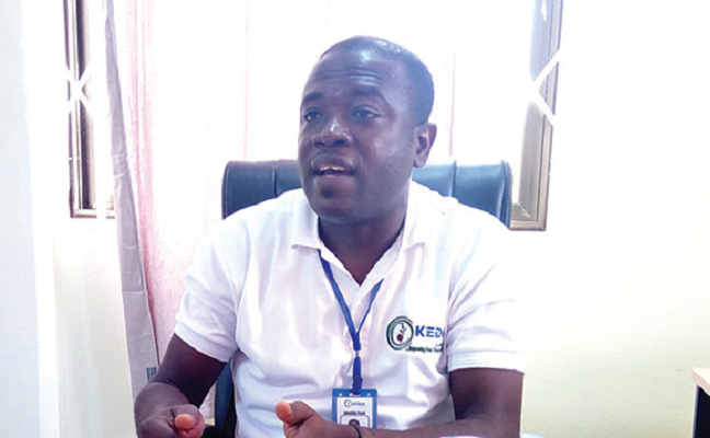 Eric Kissi explaining a point during the interview.