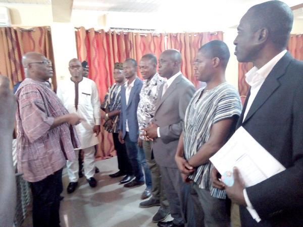  Alhaji Sulemana Alhassan (left), Upper West Regional Minister, interacting with members of the committee after the inauguration