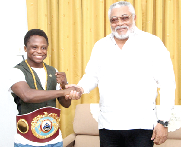 Dogboe (left) with President Rawlings
