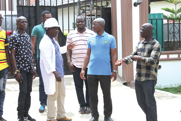 Mr Gordon Aaron Monyo ( 2nd right), GRACCU Chairman, interacting with Mr Kofi Anokye (in helmet) and some members of GRACCU