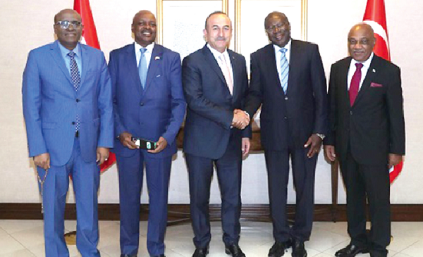 Turkey's Foreign Minister Mevlüt Çavuşoğlu (3rd right) in a handshake with the Deputy Chairperson of the African Union Commission, Thomas Kwesi Quartey, last Thursday