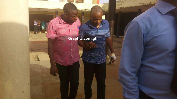 Dr Dominic Obeng Andoh in bandage leaving the court premises