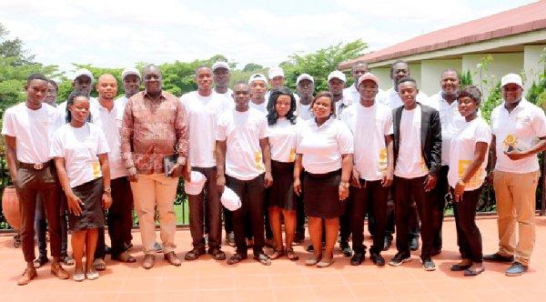 Mr Victor Oppong Adjei (3rd left), Chairman, Ghana National Association of Poultry Farmers, and the facilitators, with the business development officers after the training workshop in Kumasi. Those with them include Mr Forster Agbei Gomashie of Tradeline Consult  (3rd right).