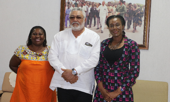 Former President Rawlings in a group photograph with the Executive Director of the National Population Council, Dr Leticia Adelaide Appiah and the Head of communication at the National Population Council, Mabel Delassie Awuku.