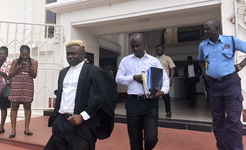 Eric Asante and his counsel leaving the court