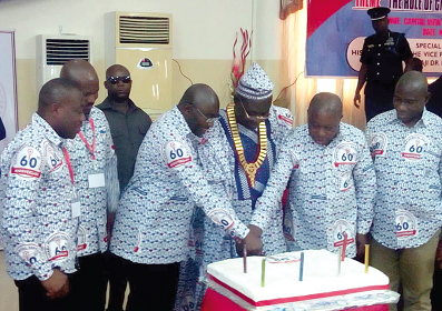 Dr Mahamudu Bawumia (2nd left) joined by Mr Kwaku Agyeman Manu (2nd right), and Dr Frank Ankobea (middle) to cut the anniversary cake. Also in the picture is Mr Eric Kwakye Dafour (right), the Eastern Regional Minister