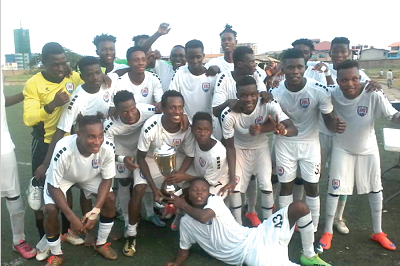 Inter Allies players celebrating with the anniversary trophy yesterday