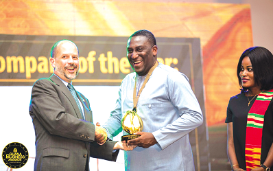 Mr Christopher J. Lamora (left) presenting the award to Mr Emmanuel Mensah