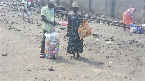  A  medicine peddler selling some of his medicines along the  railway lines  in Accra 