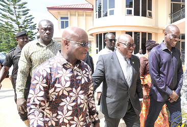 President Akufo-Addo being escorted to the workshop by Mr Osei Kyei-Mensah-Bonsu (left), Majority Leader, and Mr Haruna Iddrisu (right), Minority Leader