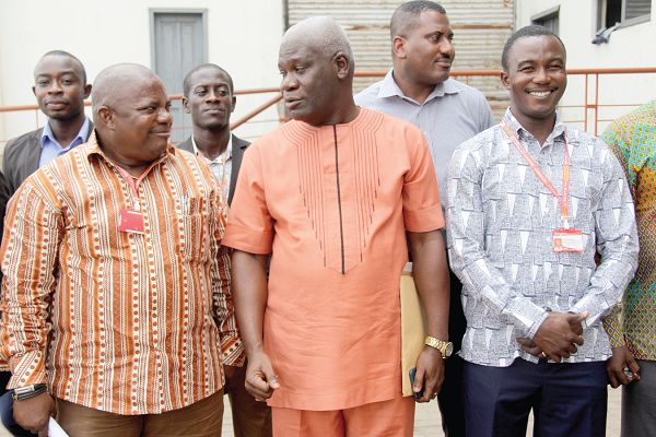 Mr Solomon Kotei (middle) in an interaction with Mr Ransford Tetteh (left), after the ceremony. Picture: EDNA ADU-SERWAA
