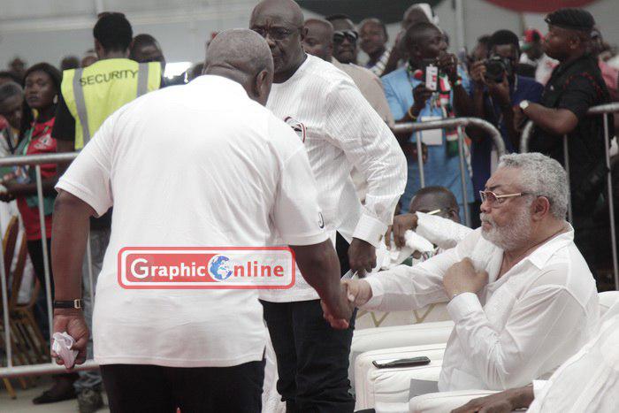 Former presidents Jerry John Rawlings and John Dramani Mahama in a handshake whilst former Speaker of Parliament, Doe Adjaho stands and look on in the background. PICTURES BY ISAAC YEBOAH