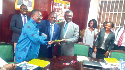  Dr Owusu Afriyie Akoto (left), Prof. Kwabena Frimpong-Boateng (right) and Dr Ephraim Mukisira exchanging the agreement after the signing. Picture: EBOW HANSON