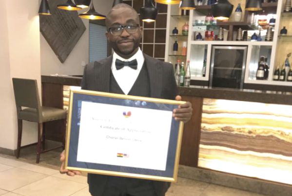 • Charles Benoni Okine, Assistant Editor of the Graphic Business, displaying his award