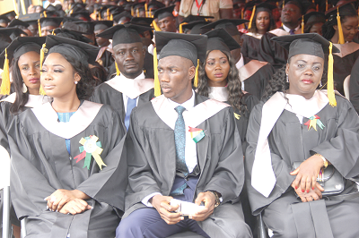 A section of the graduates. Inset: Dr Samuel H. Donkor (left), the President and Founder, All Nations University College, and Mr Joe Mensah (2nd left), Vice-President, Country Manager-Ghana, Kosmos Energy, congratulating Mr James Nana Acquah (right) for winning the Overall Best Graduate award. Pictures: EDNA ADU-SERWAA