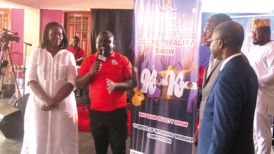  Mrs Araba Sika Tobbin (left), Mr Albert Kwabena Dwumfour (2nd left) unveiling the logo for the reality show, while Mr Roland Affail Monney and Apostle John Osei Amanimpong look on