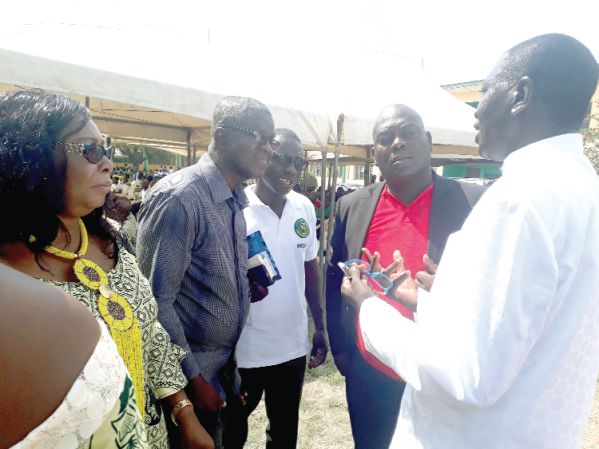 •  Dr Samuel Ato Duncan (right) and Mrs Anastasia Thomford Okyere (left) in a chat with other guests at the event.